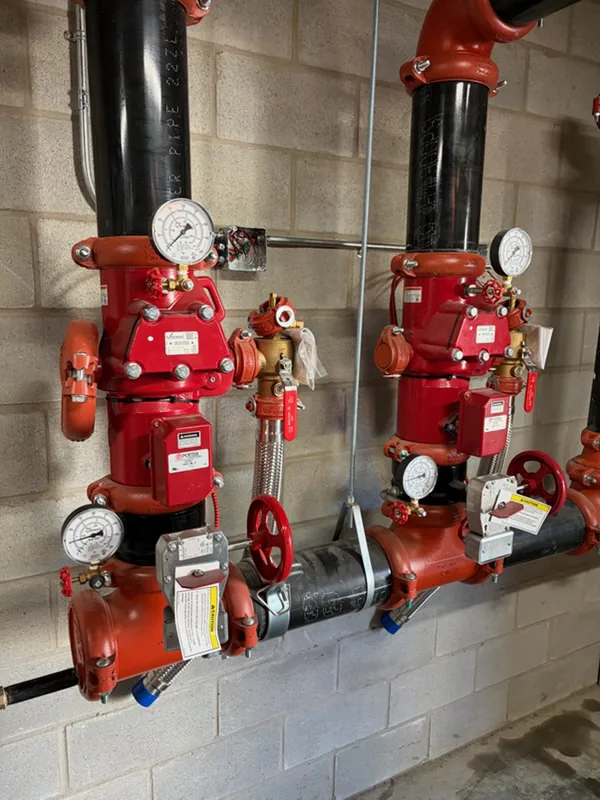 Alarm valve stations of a sprinkler system